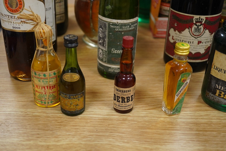 Twenty bottles of spirits, liqueurs and wine, together with some half bottles and miniatures, including; a 1947 Heidsieck & Co. Dry Monopole champagne, a 1983 Chateau Ferrande Bordeaux, two bottles of Herbes Mesclades, a